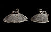 Due coperchi in impasto nero a bassa calotta emisferica, decorati a strigilature con presa a leoncino retrospicente, pertinenti a pissidi.